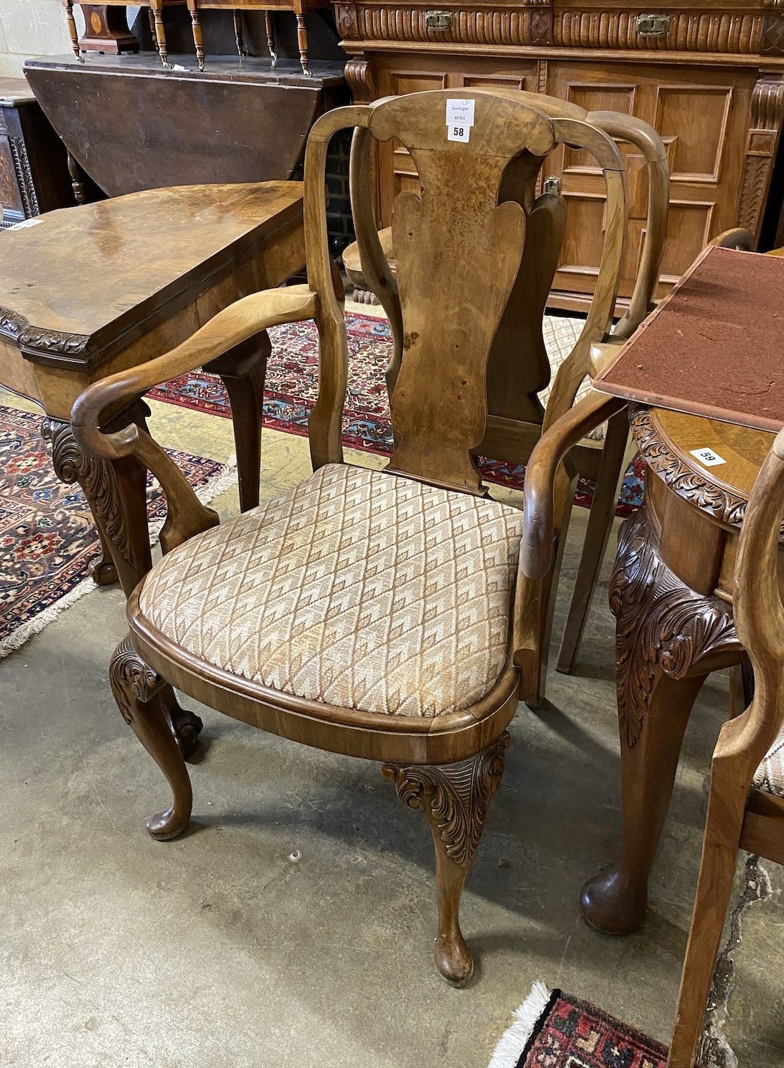 A set of eight Queen Anne revival walnut dining chairs, (two with arms, six single)